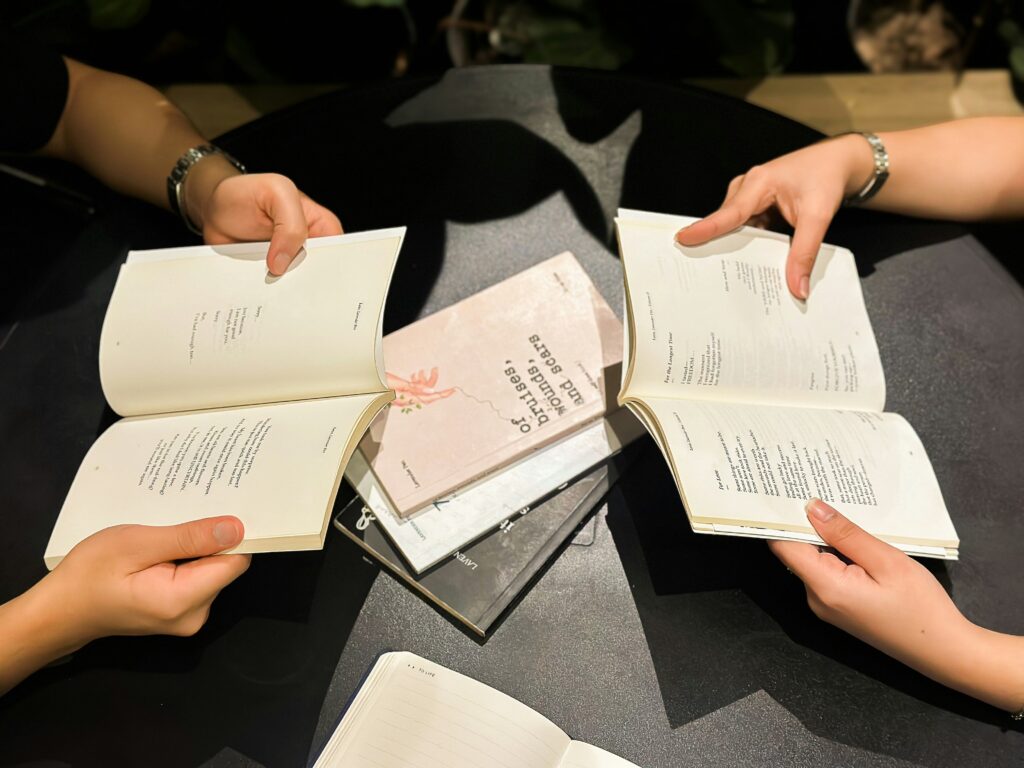 Hands and books photo by Bill Ringer